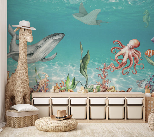 Underwater mural featuring a whale, octopus and coral reef for nursery.