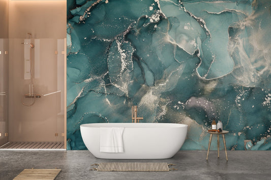 Large teal marble wall mural behind a freestanding white bathtub.