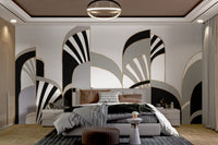 Modern Art Deco wall mural featuring layered arch in large bedroom.