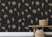 Patterned black wallpaper with gold details behind a rustic wooden bench.