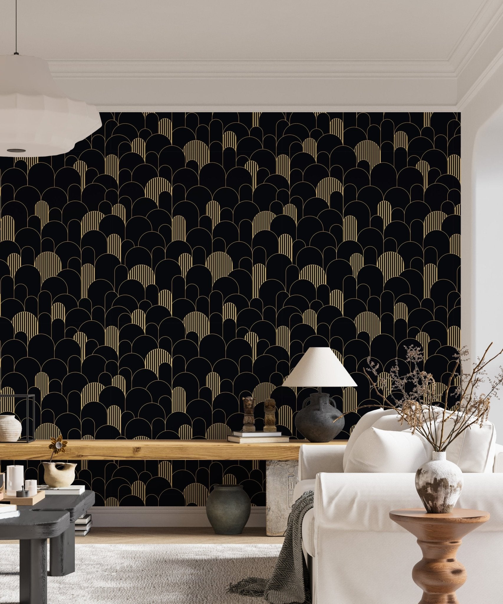 Modern black and gold wallpaper in a bright living space with a wooden desk.