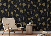 Art Deco Golden Lines Repeat Pattern Wallpaper in a room with a beige accent chair.