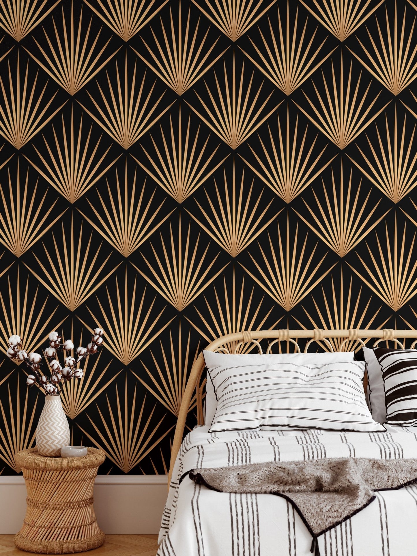 Black and gold geometric wallpaper behind wooden chair and side table.