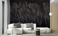 Contemporary living area with white seating and dark botanical wall mural.