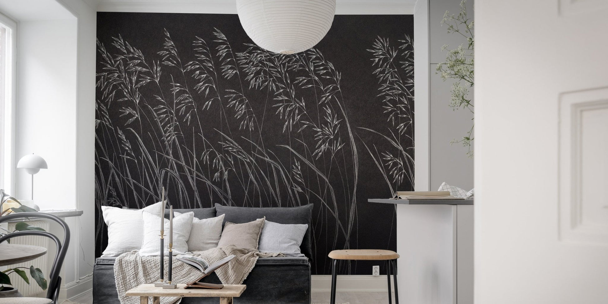 Living room with monochrome botanical leaves wall mural.
