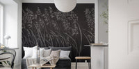 Living room with monochrome botanical leaves wall mural.