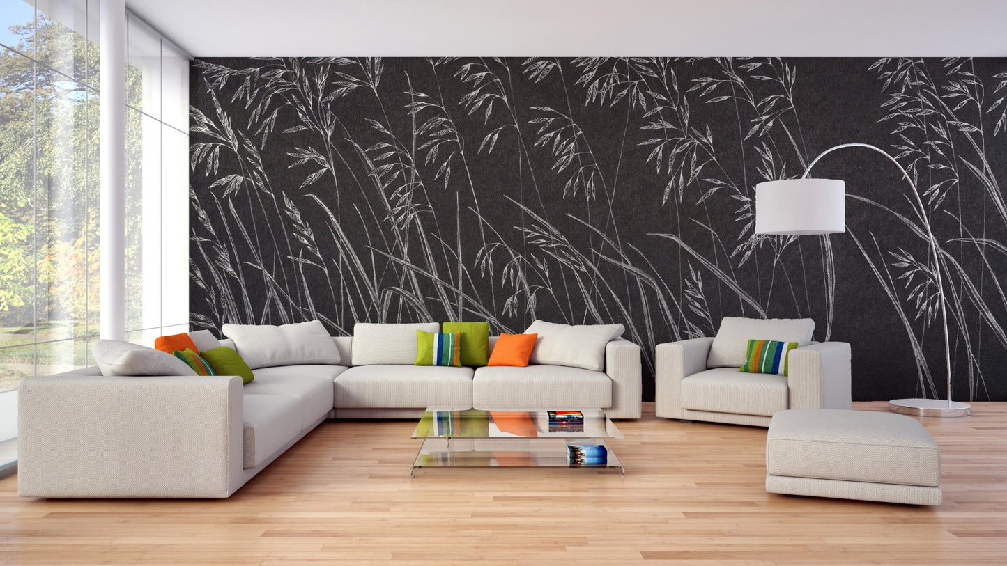 Large living room featuring black botanical leaves wall mural and white sectional sofa.