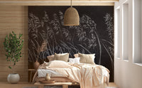 Boho bedroom featuring Artistic Dark Leaves Wall mural and wicker lamp.