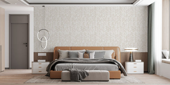 Artistic Herringbone Fusion Wallpaper behind a low wooden bed frame in a bedroom.