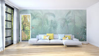 Mint green tropical forest wall mural in a large living room with a white sofa.