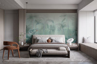 Muted green forest wall mural behind a grey upholstered bed frame.