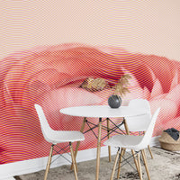 Peach and red rose wall mural behind a white circular dining table.