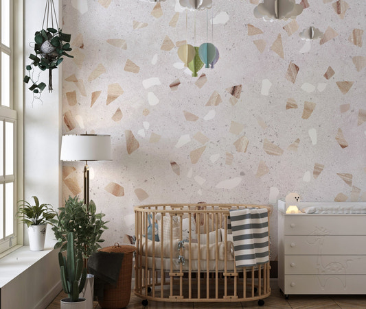 Artistic Terrazzo Marble Wall Mural in a nursery with a wooden crib.