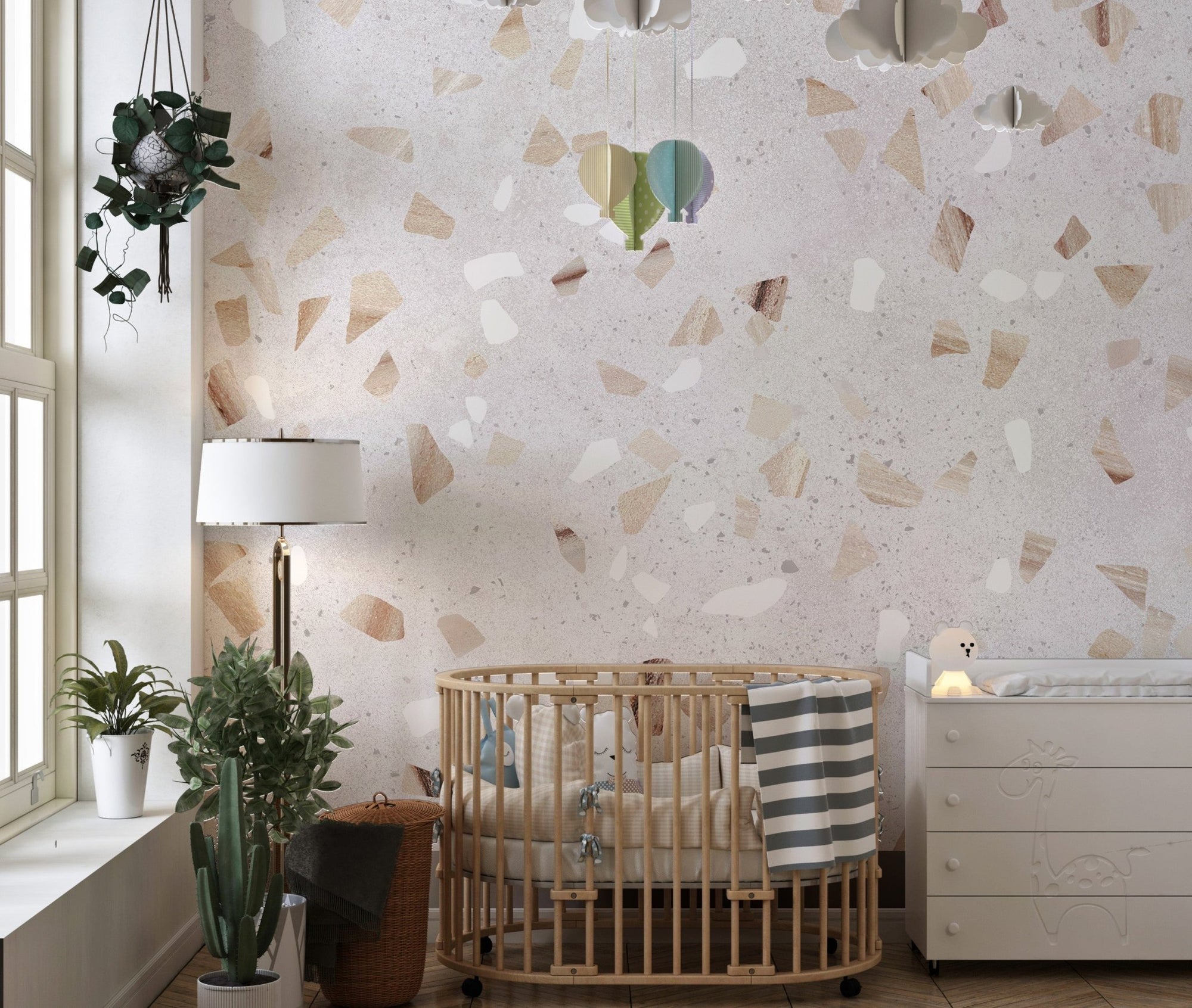Artistic Terrazzo Marble Wall Mural in a nursery with a wooden crib.