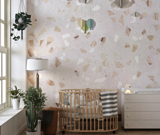 Artistic Terrazzo Marble Wall Mural in a nursery with a wooden crib.