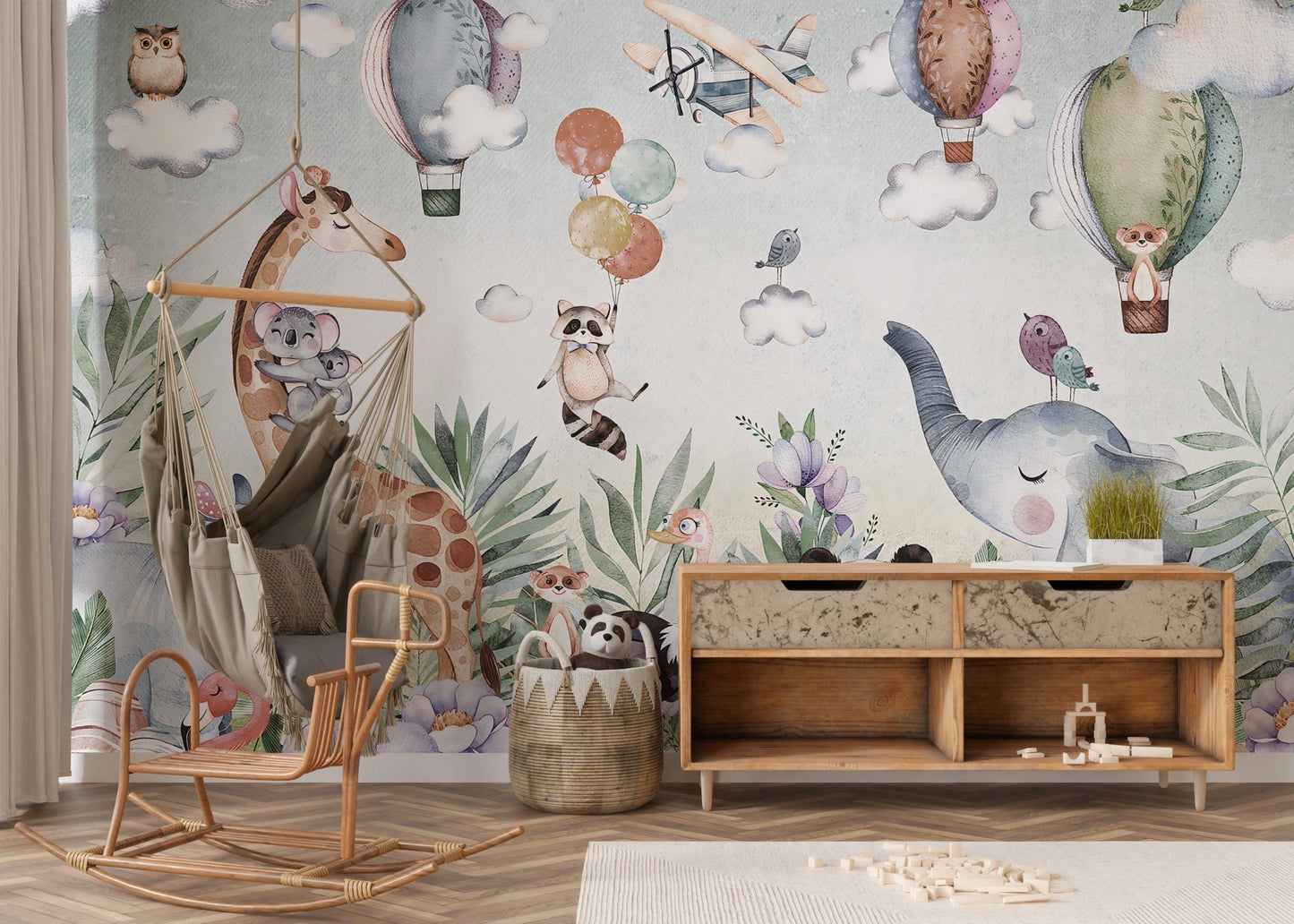 Wildlife wall mural with hot air balloons in a contemporary nursery room.