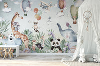 Playroom corner displaying a light blue wildlife and nature wall mural.