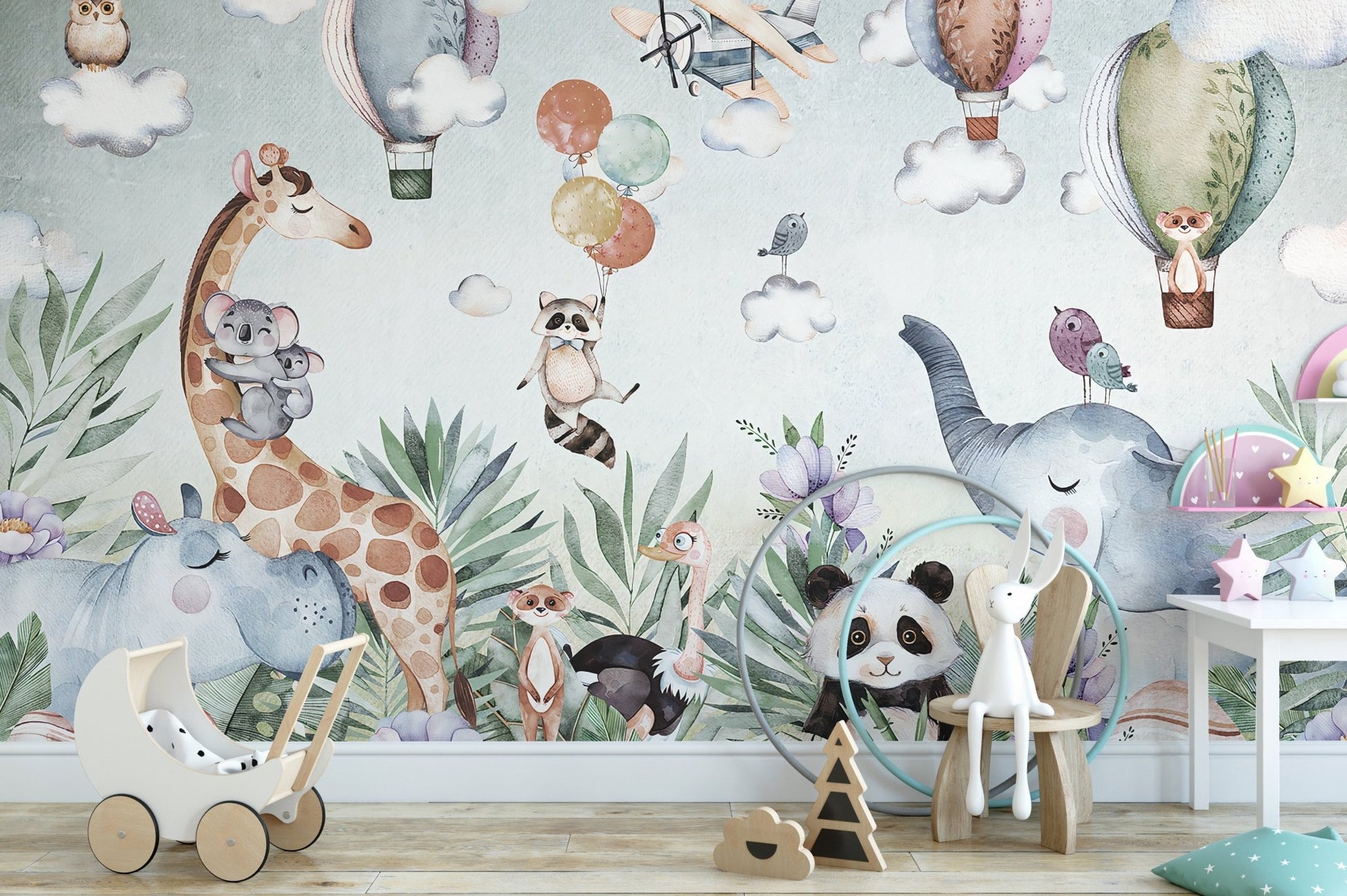 Animal art wall mural with giraffe and panda in a children playroom setting.