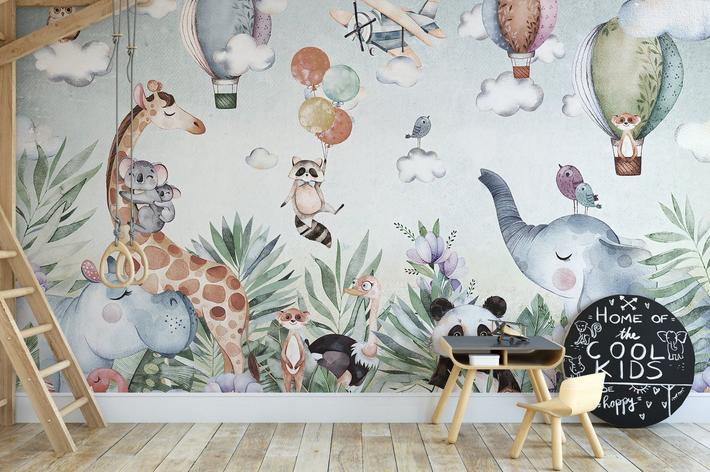 Nursery featuring a detailed wildlife and nature themed wall mural.