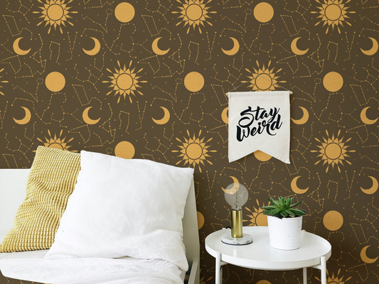 Astrology constellations design wallpaper with golden celestial motifs on brown.