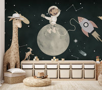 Astronaut monkey joyfully sitting on the moon mural with a rocket in space.