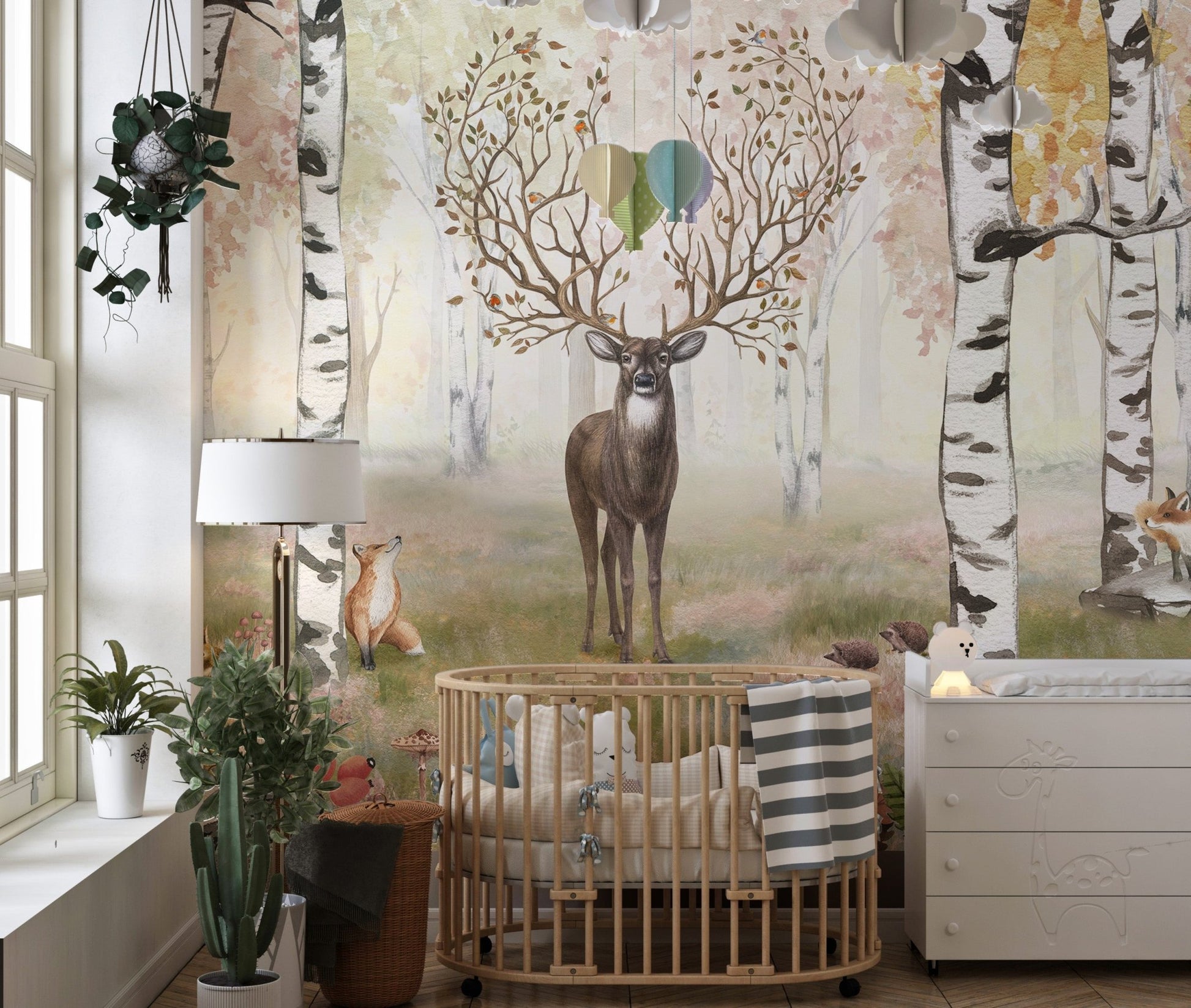 Woodland majesty mural highlighting antlered deer for toddler's room walls.
