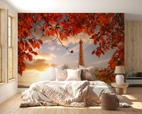 Red autumn foliage wallpaper mural in a warm lit bedroom with beige linens.