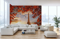Eiffel Tower wallpaper mural with red autumn leaves in a bright living room.