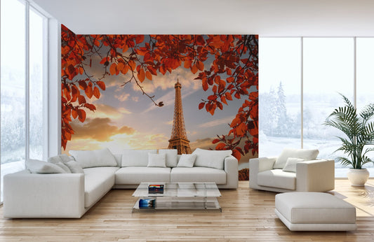 Eiffel Tower wallpaper mural with red autumn leaves in a bright living room.