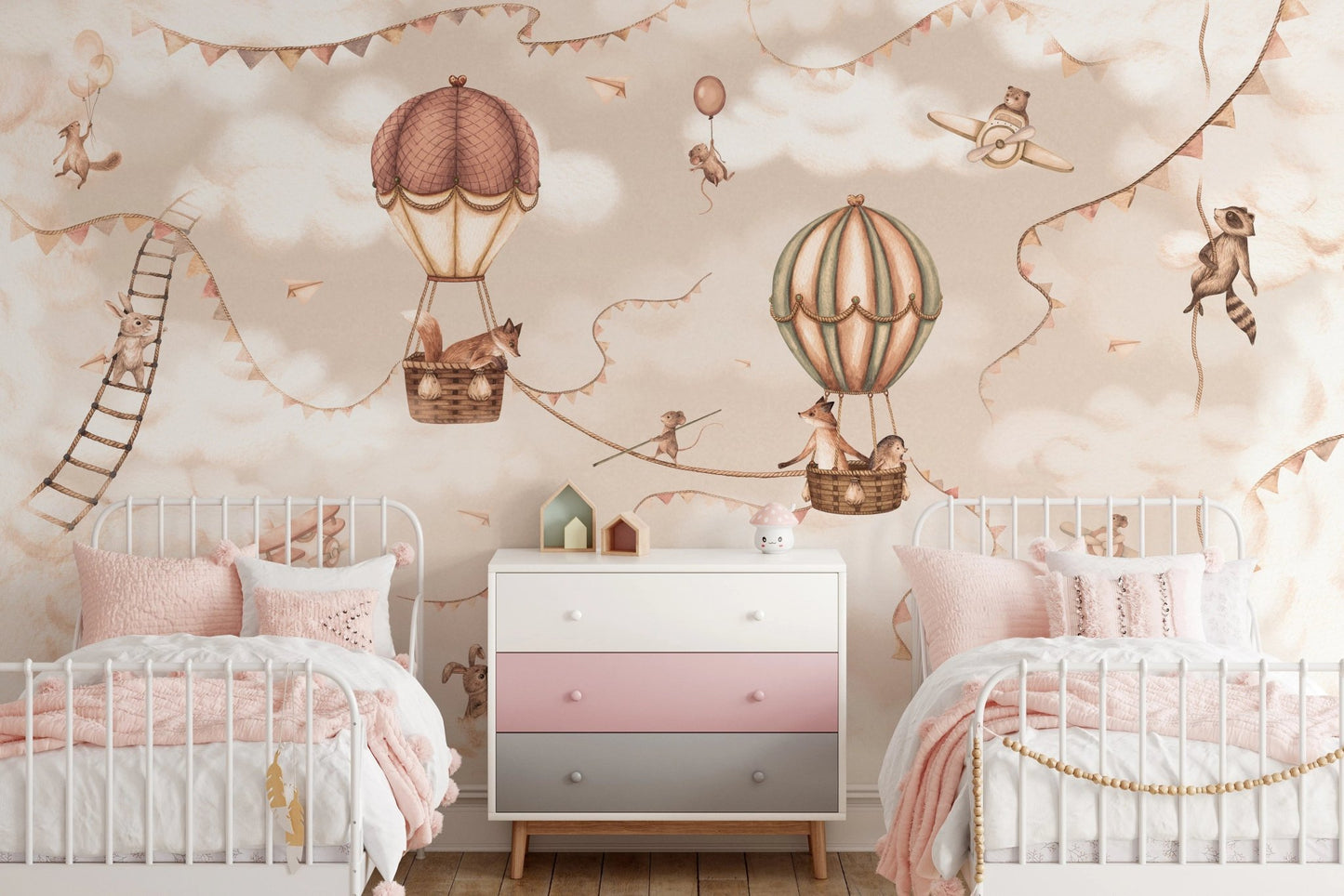 Shared kids bedroom with two white beds and aviation wall mural.