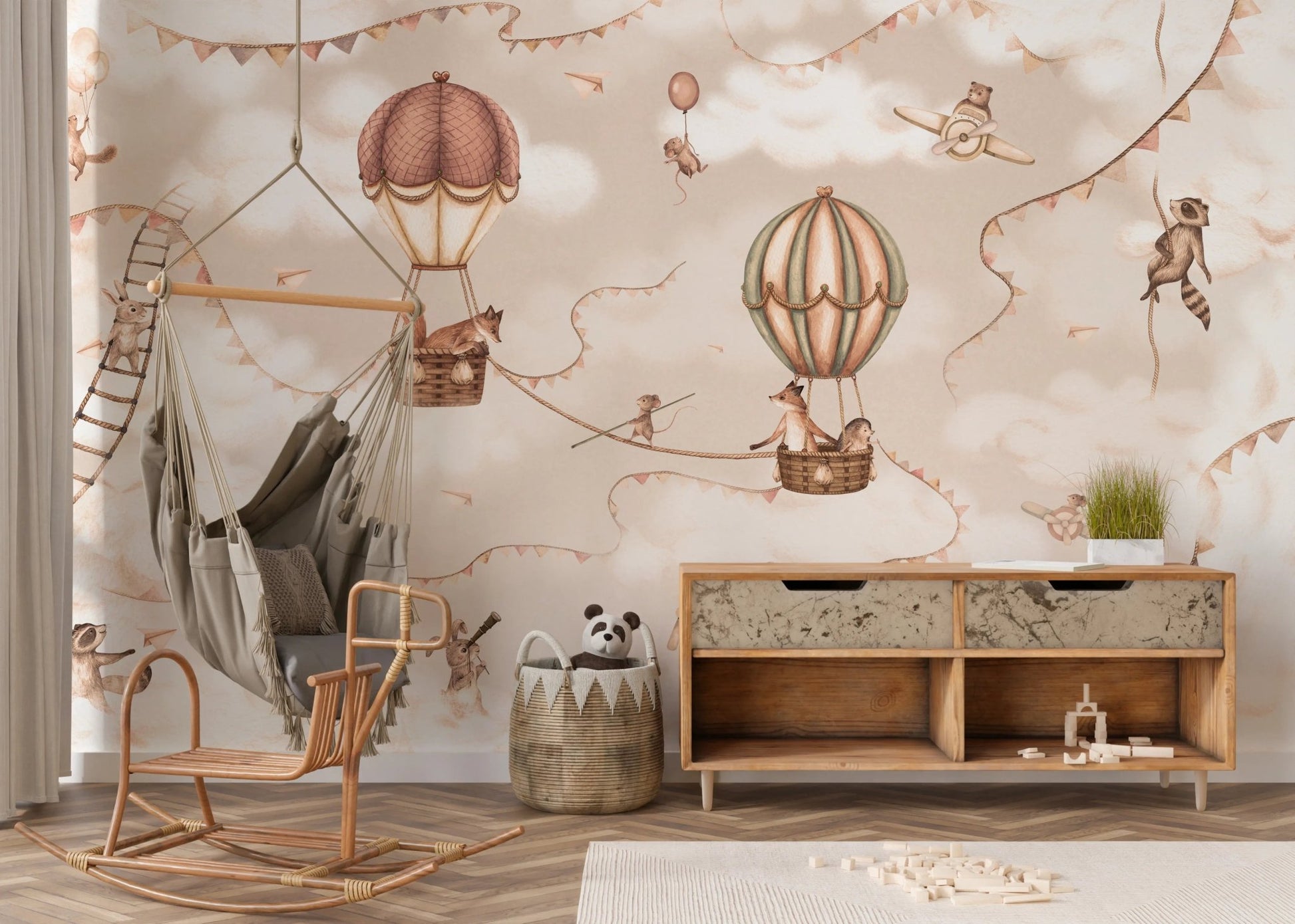 Minimalist nursery with a rocking chair and neutral aviation wall mural