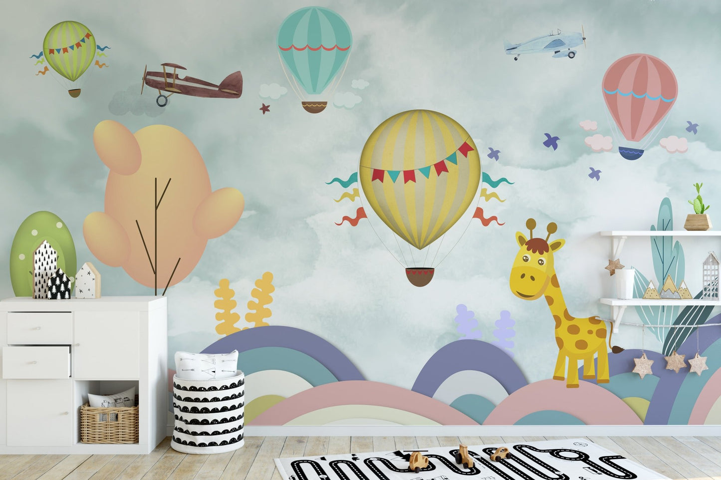Toy storage unit in front of a Balloon & Multicolor Cartoon Wall mural in kids room.