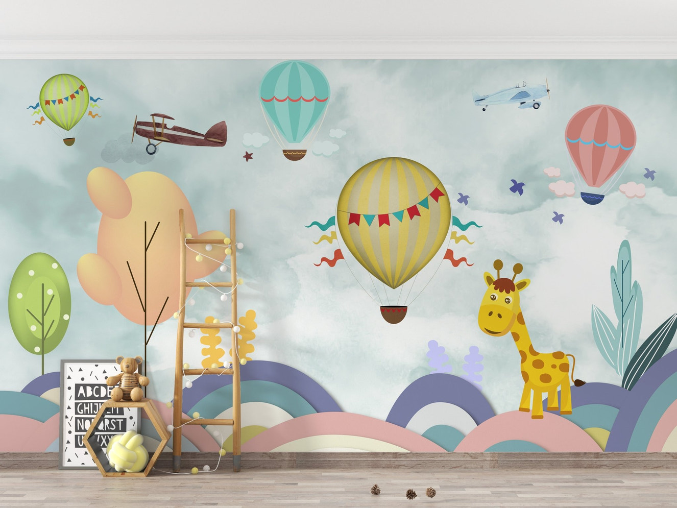 Kids nursery wall mural featuring a yellow giraffe and hot air balloons on blue sky.