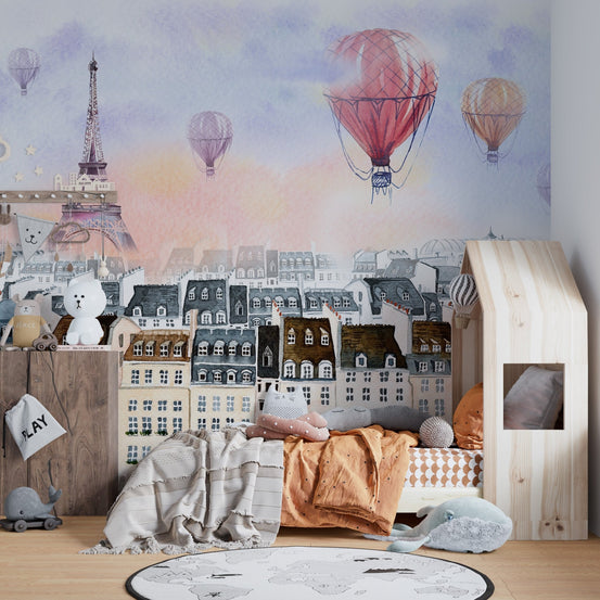 Balloon Over Paris wall mural in a kids' bedroom with a wooden house bed.