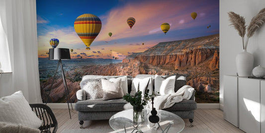 Hot air balloons sunset wallpaper mural with canyon landscape.