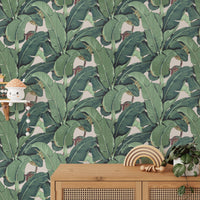 Natural leaf pattern wall mural in a minimalist hallway with a side table.