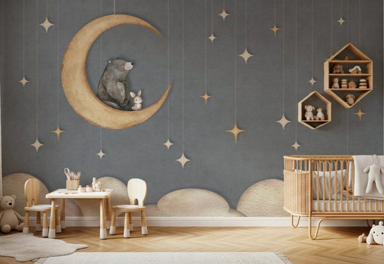 Playroom wall mural showing a sleeping bear on a moon with gold stars.