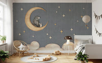 Kids bedroom featuring a gray bear and moon wall mural with wooden furniture.