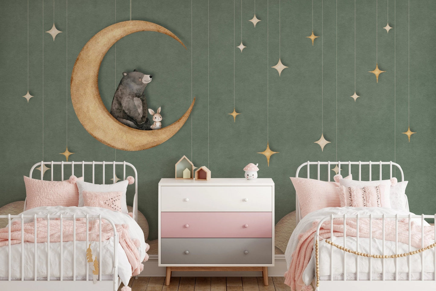 Twin bedroom setup with pink bedding and bear on the moon wall mural.