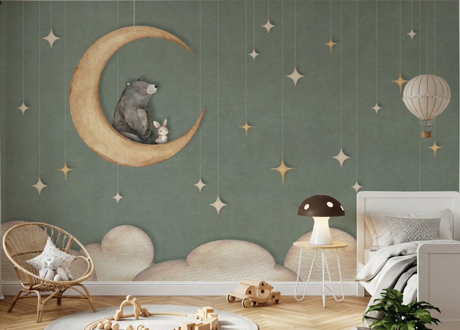 Wide view of a bright bedroom with a large moon and star wall mural.
