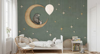 Childrens bed against a Bear on The Moon Green Wall Mural with clouds.