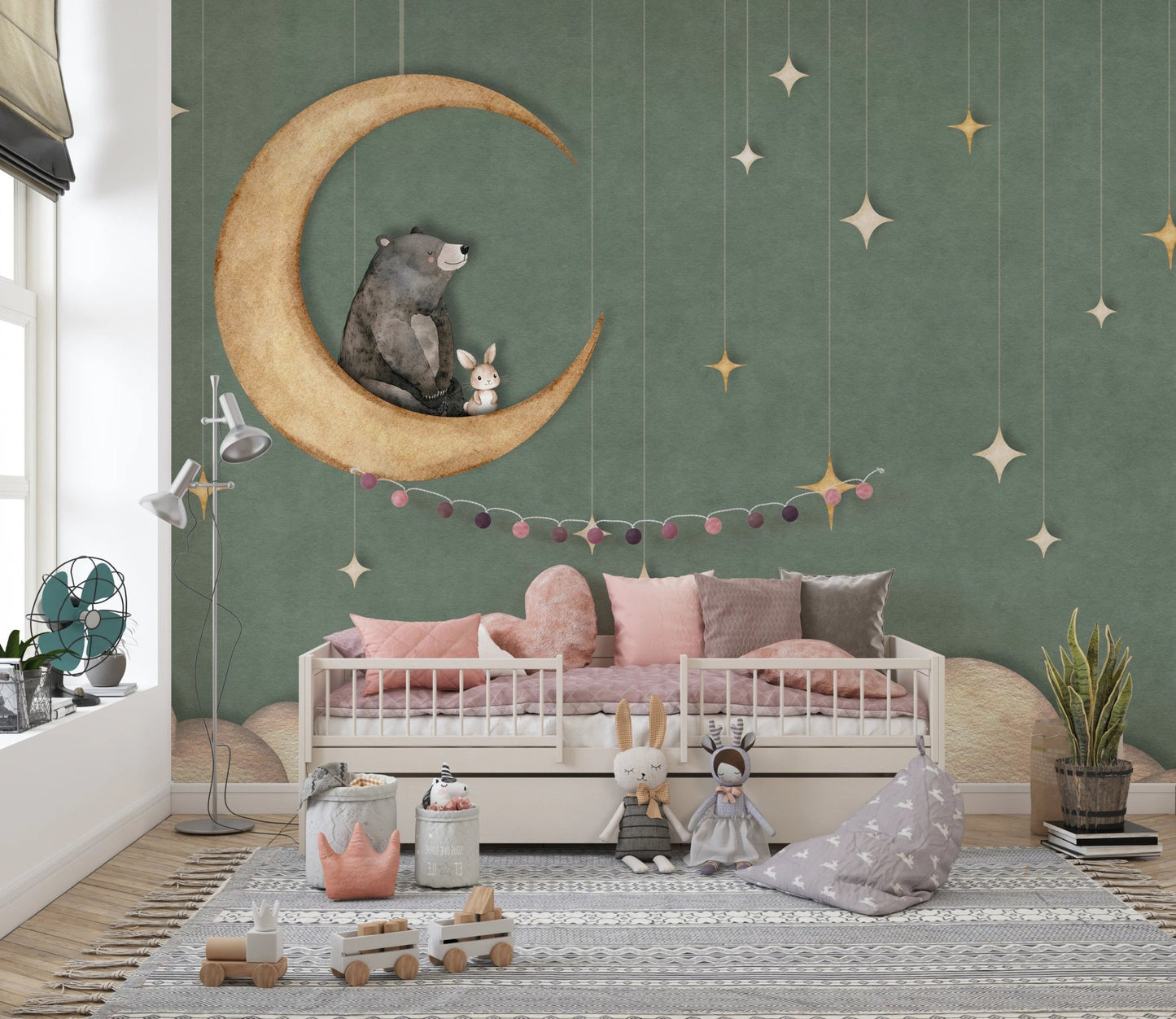 Minimalist kids space with a moon and stars wall mural and floor rug.
