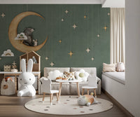 Toddler room with a small table set and green bear themed wall mural.