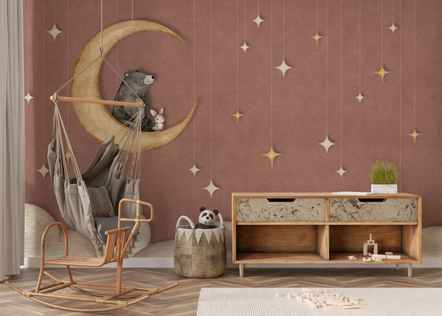 Modern playroom with a wooden sideboard and bear on moon wall mural.