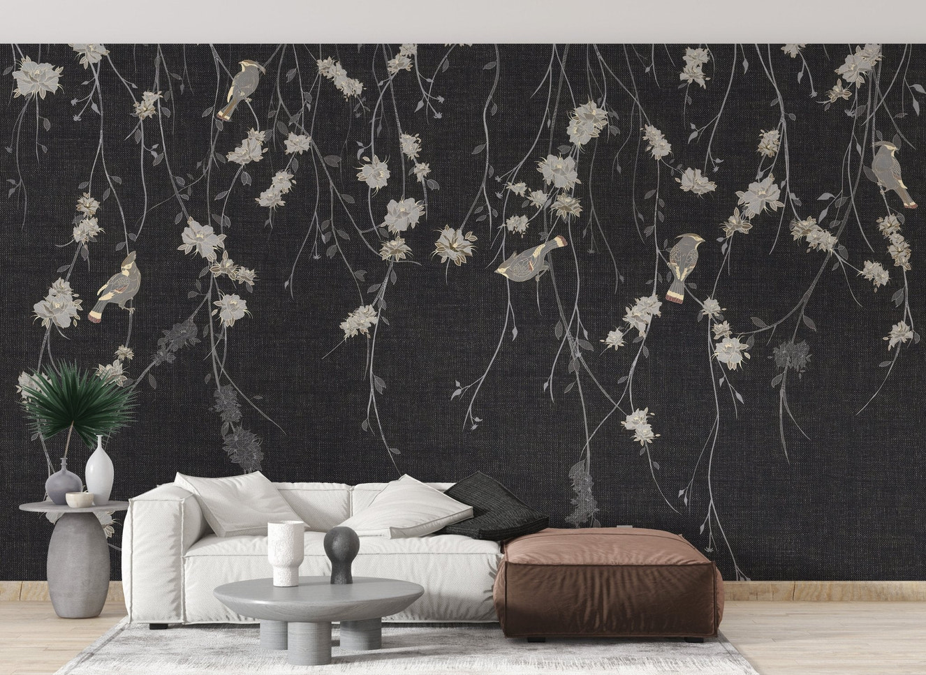 Modern living featuring charcoal floral wall mural and white sectional couch.