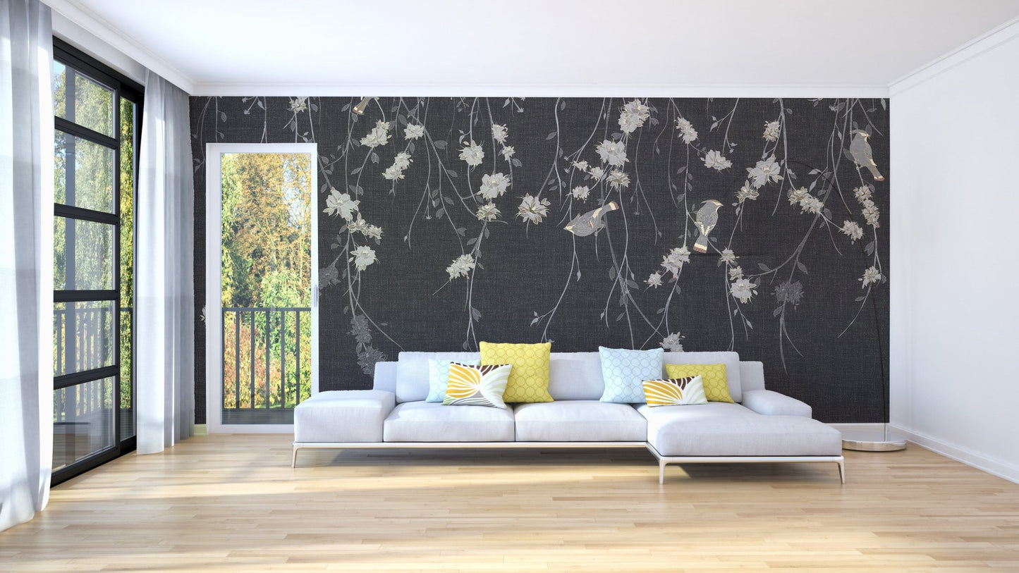 Sunlit room featuring dark black flowers & birds wall mural and white sofa.