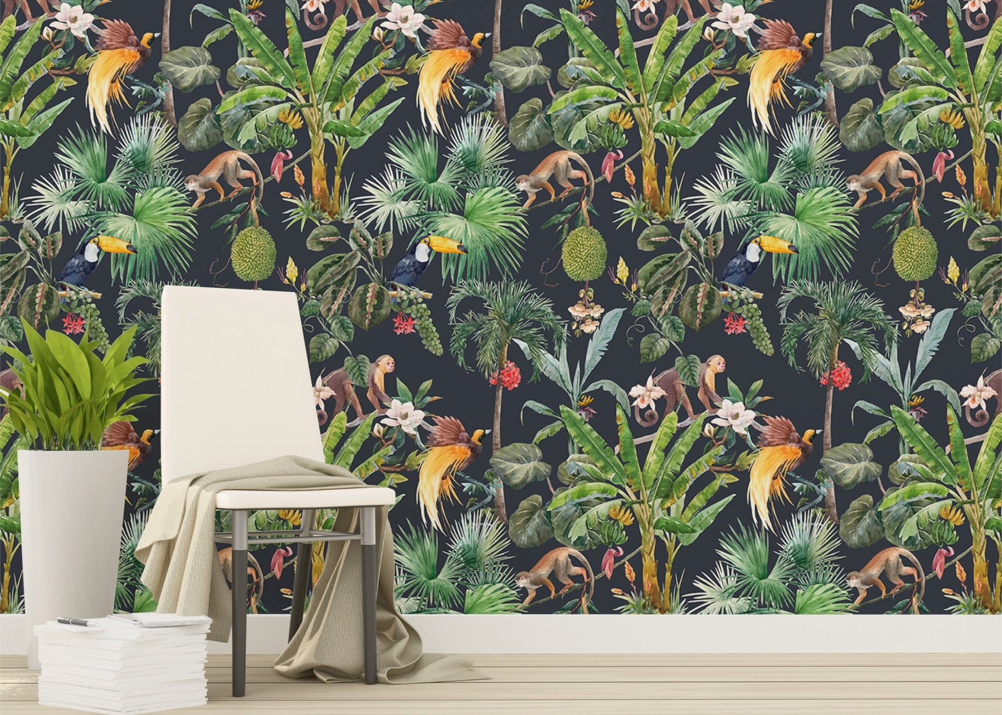 Tropical watercolor pattern wall mural behind a white chair and green indoor plant.