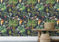 Exotic floral wall mural behind wooden console table in a minimalist entryway.