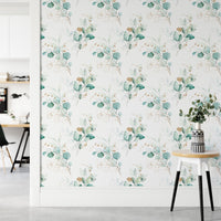Beautiful watercolor eucalyptus branches green wallpaper in a hallway with a side table