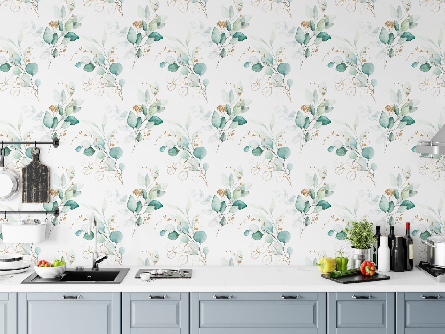 Botanical green wallpaper in a kitchen setting above a white countertop